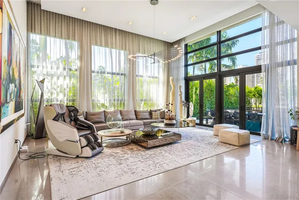 a view of a patio with table and chairs and potted plants