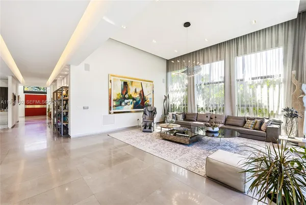 a view of a roof deck with potted plants and palm trees