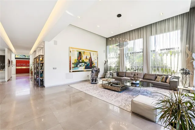 a view of a roof deck with potted plants and palm trees
