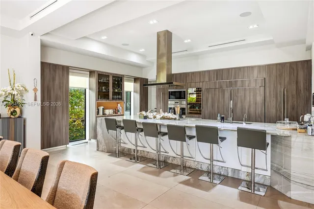a bathroom with a granite countertop shower a mirror and a sink