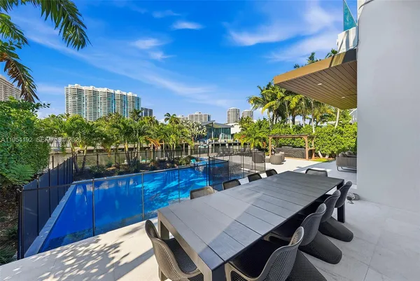 a view of a yard with a house in the background