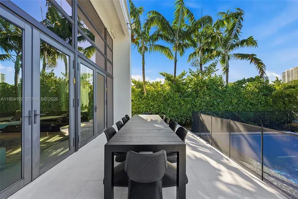 a view of a lake with a table and chairs