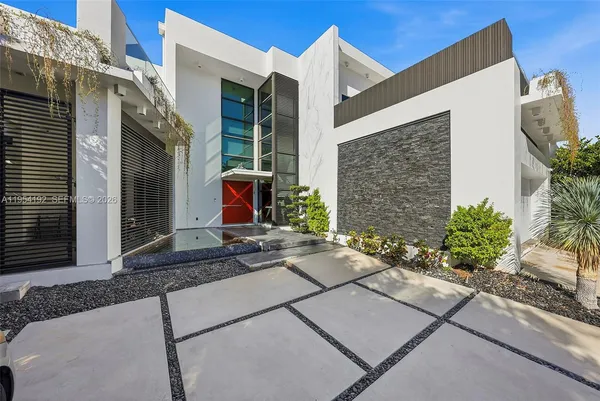 an aerial view of house with yard swimming pool and outdoor seating