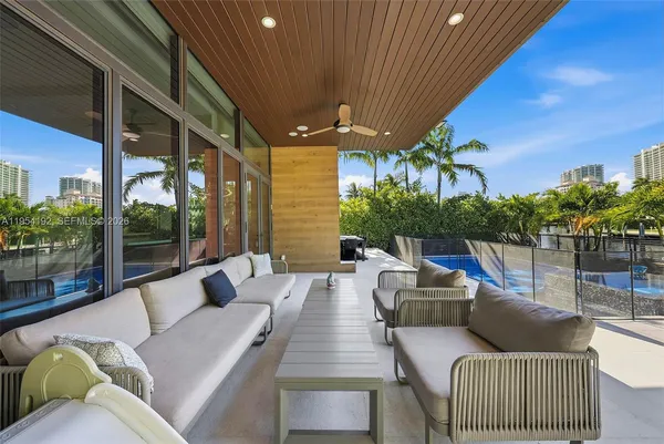 a bedroom with a large bed and a large window