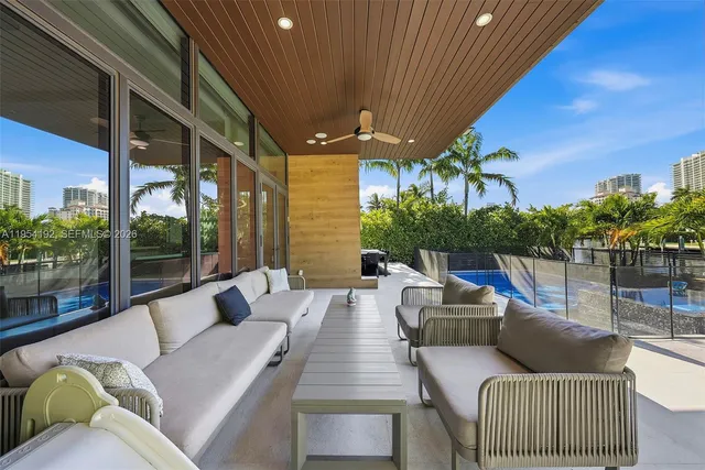 a bedroom with a large bed and a large window