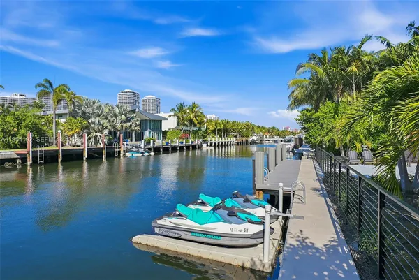 a bathroom with a sink a toilet and shower curtain