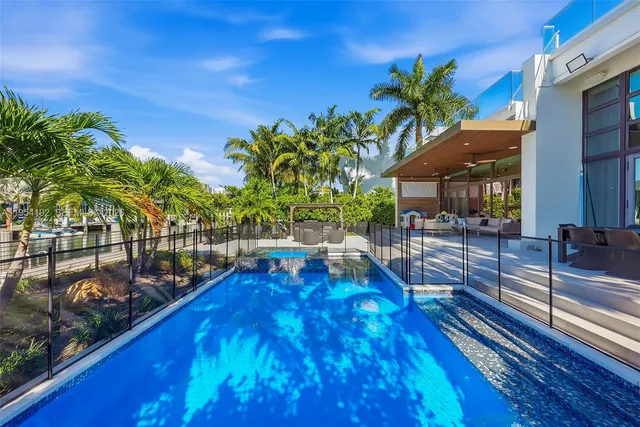 a spacious bedroom with a bed couch and a window