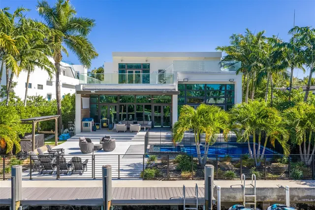 an aerial view of residential building with outdoor space and lake view