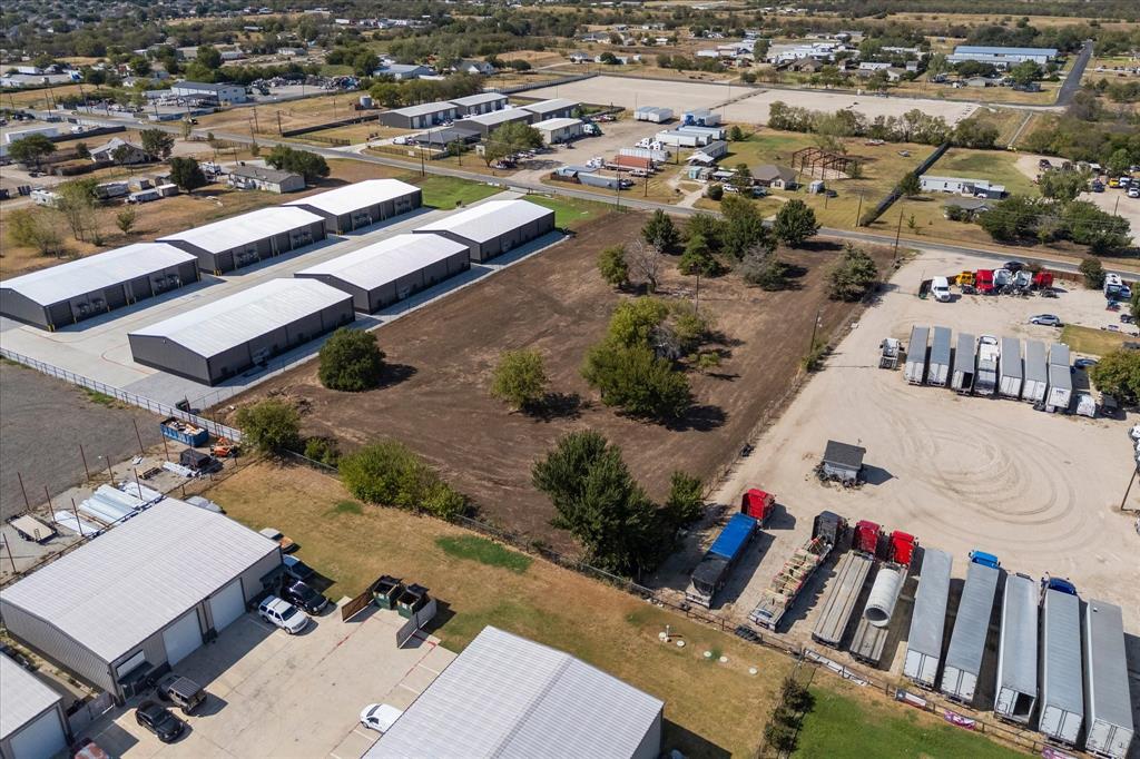 17326 Gaffield Road Justin, TX 76247 - Photo 19 of 21 Multiple metal-clad industrial buildings with roll-up doors and substantial paved parking areas