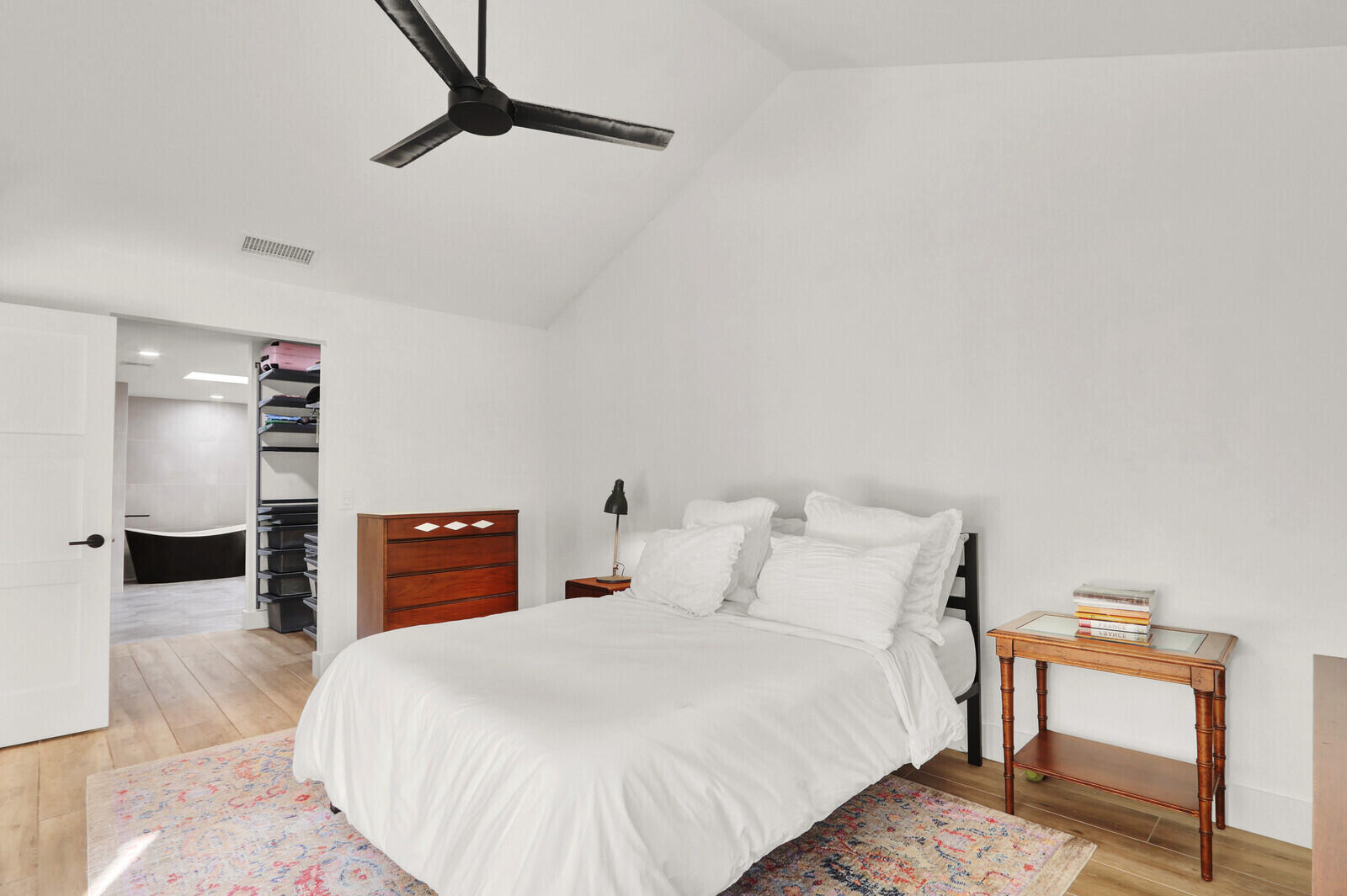 246 Ridge Road Jupiter, FL 33477 - Photo 16 of 39 a bedroom with a bed and a dresser