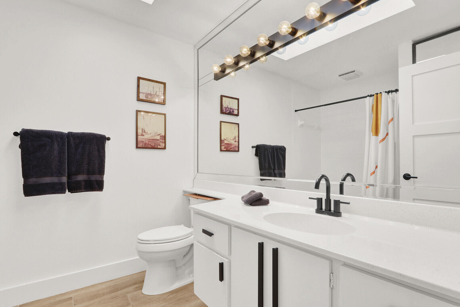 246 Ridge Road Jupiter, FL 33477 - Photo 22 of 39 a bathroom with a toilet sink and mirror