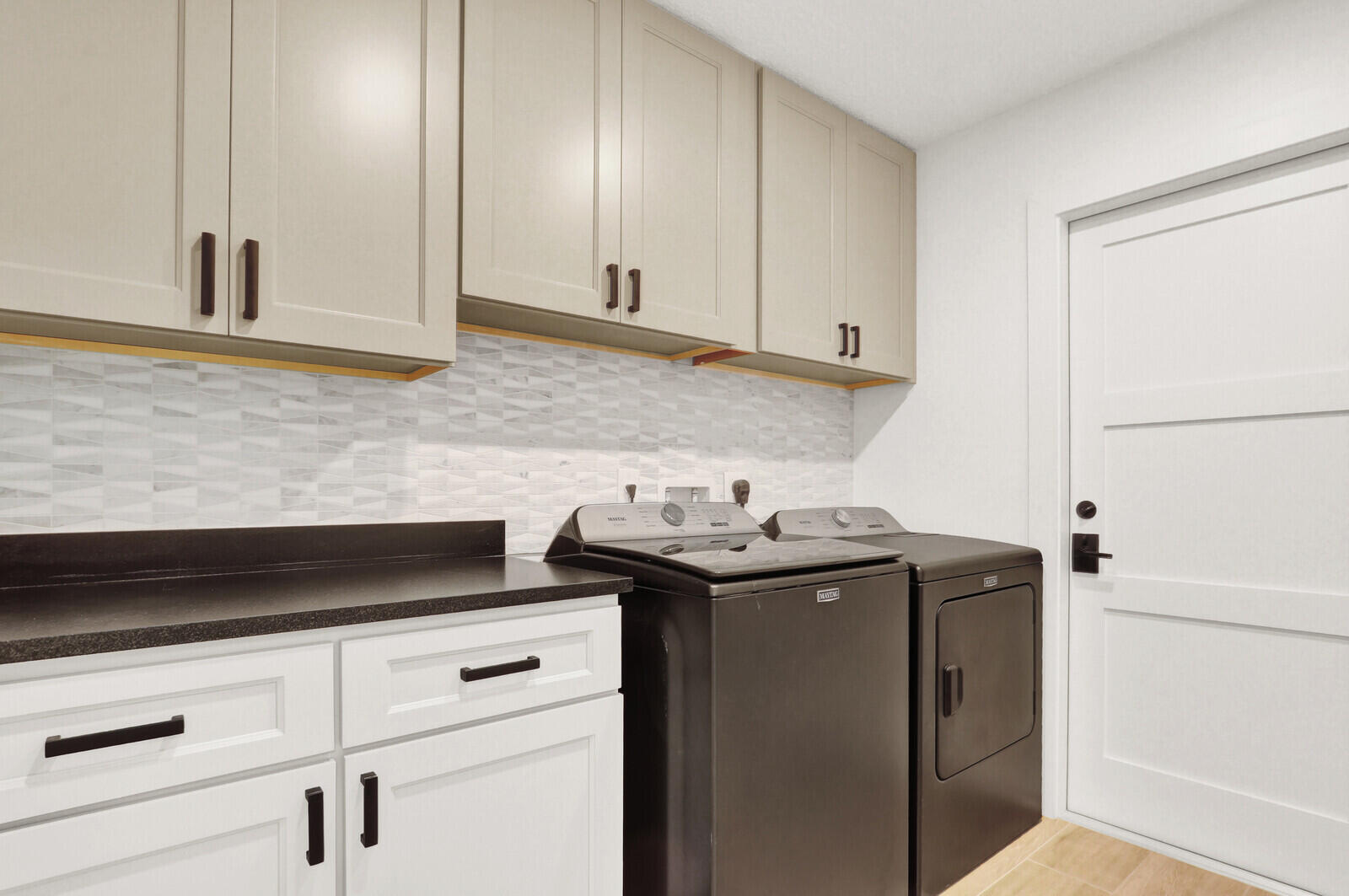 246 Ridge Road Jupiter, FL 33477 - Photo 23 of 39 a kitchen with stainless steel appliances granite countertop white cabinets sink and dishwasher
