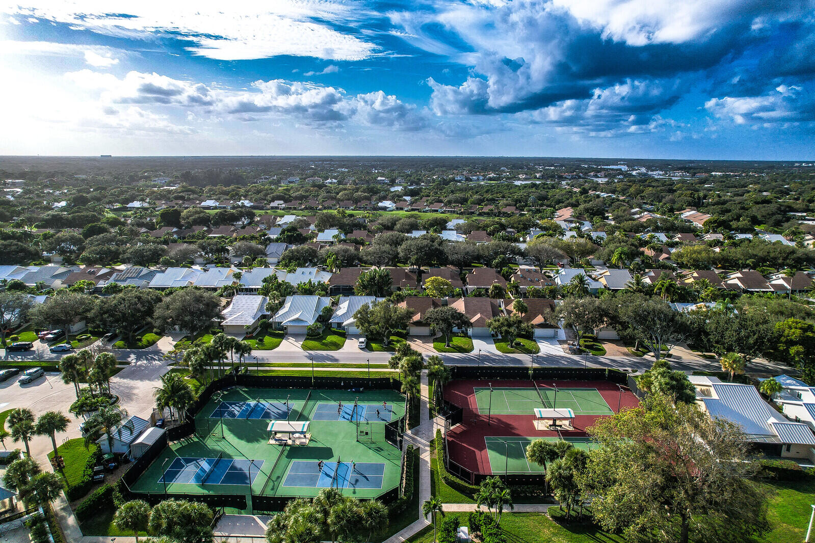 246 Ridge Road Jupiter, FL 33477 - Photo 35 of 39 an aerial view of residential houses with outdoor space and trees