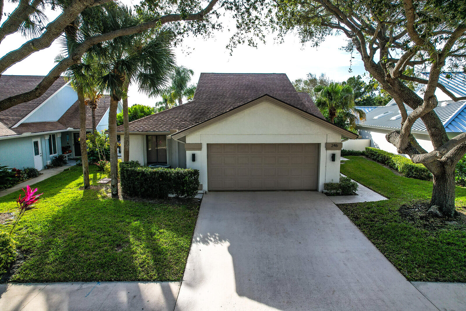 246 Ridge Road Jupiter, FL 33477 - Photo 38 of 39 a front view of house with yard and green space