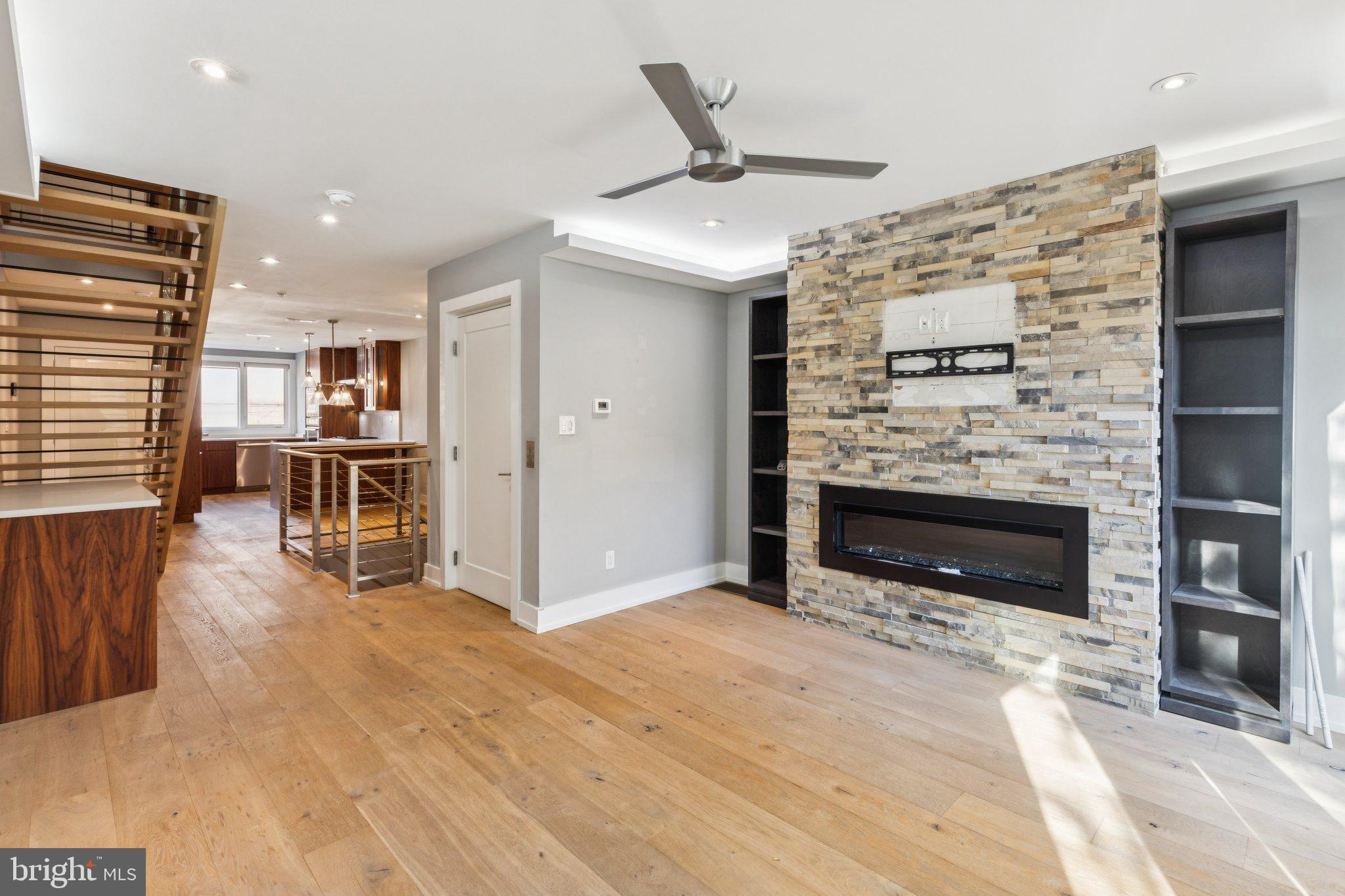 719 South 20th Street Philadelphia, PA 19146 - Photo 16 of 53 a view of livingroom with kitchen and fireplace