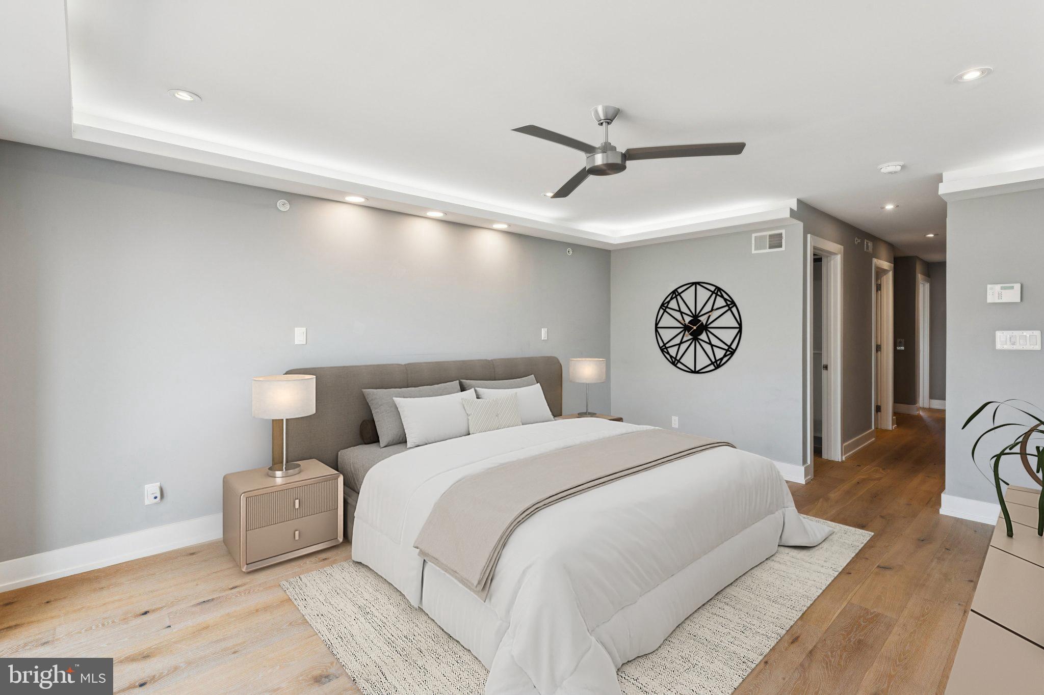 719 South 20th Street Philadelphia, PA 19146 - Photo 33 of 53 a bedroom with a bed and a ceiling fan