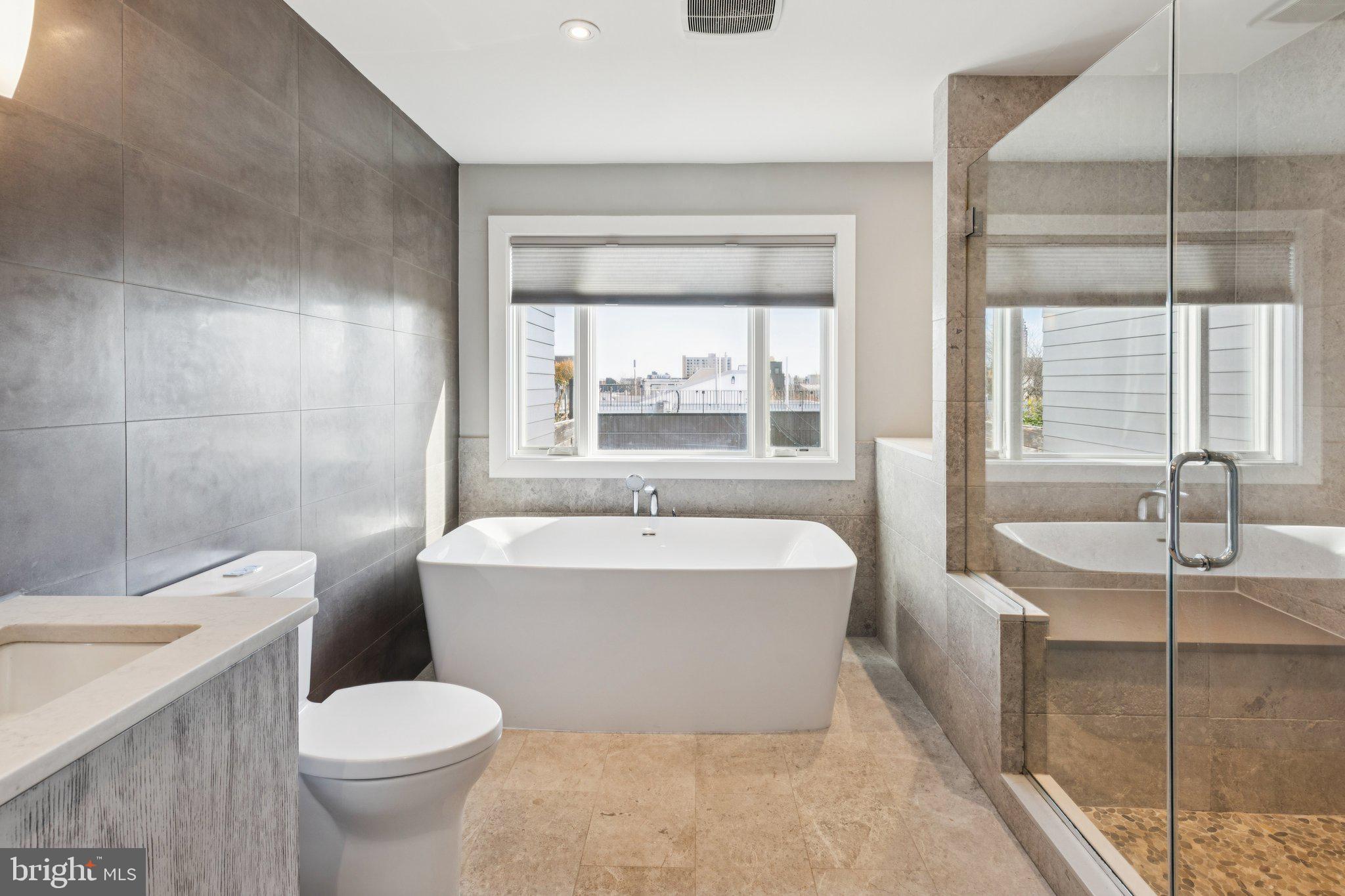 719 South 20th Street Philadelphia, PA 19146 - Photo 37 of 53 a bath room with a toilet a sink and a bath tub