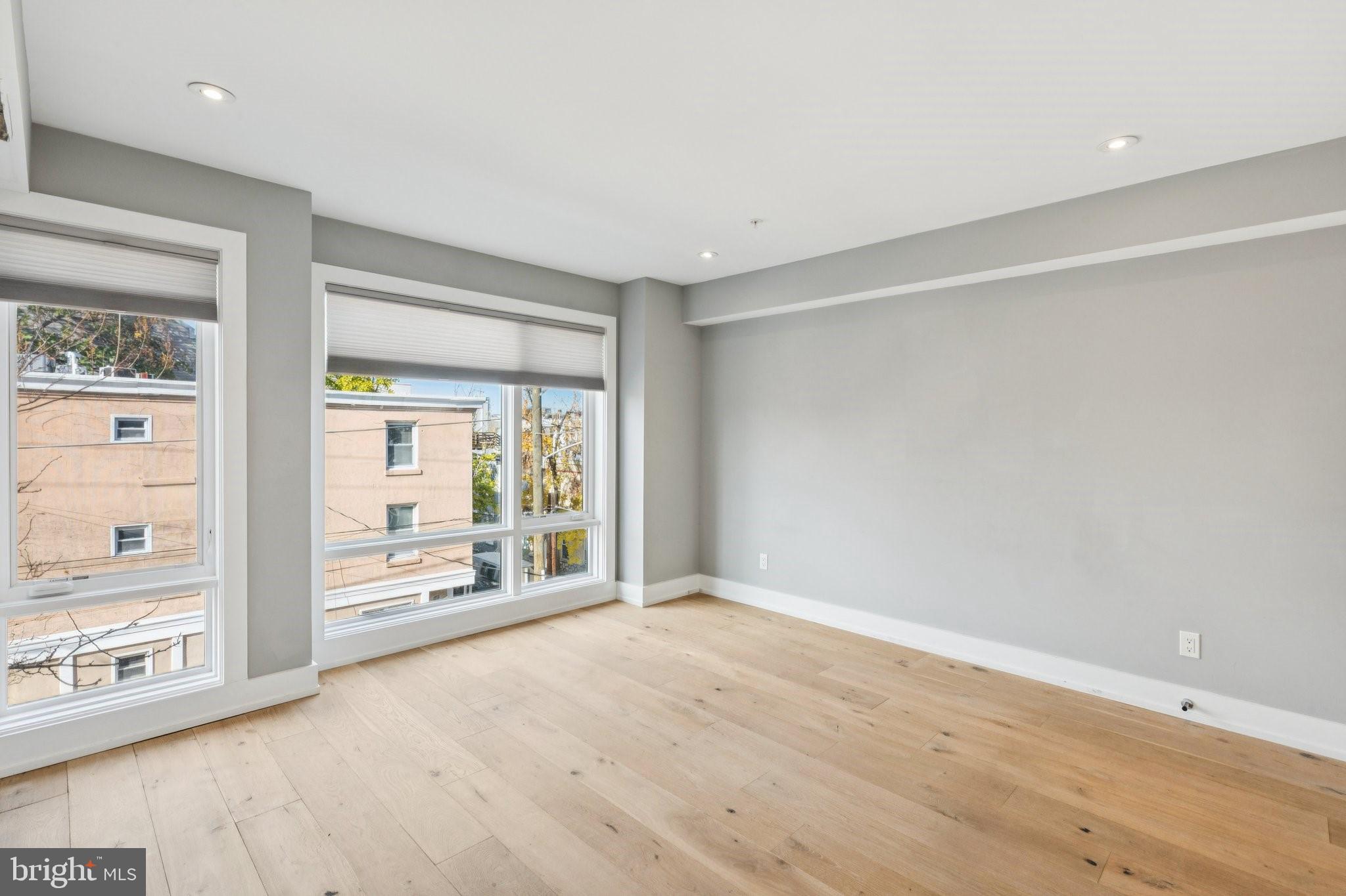 719 South 20th Street Philadelphia, PA 19146 - Photo 40 of 53 a view of an empty room with wooden floor and a window