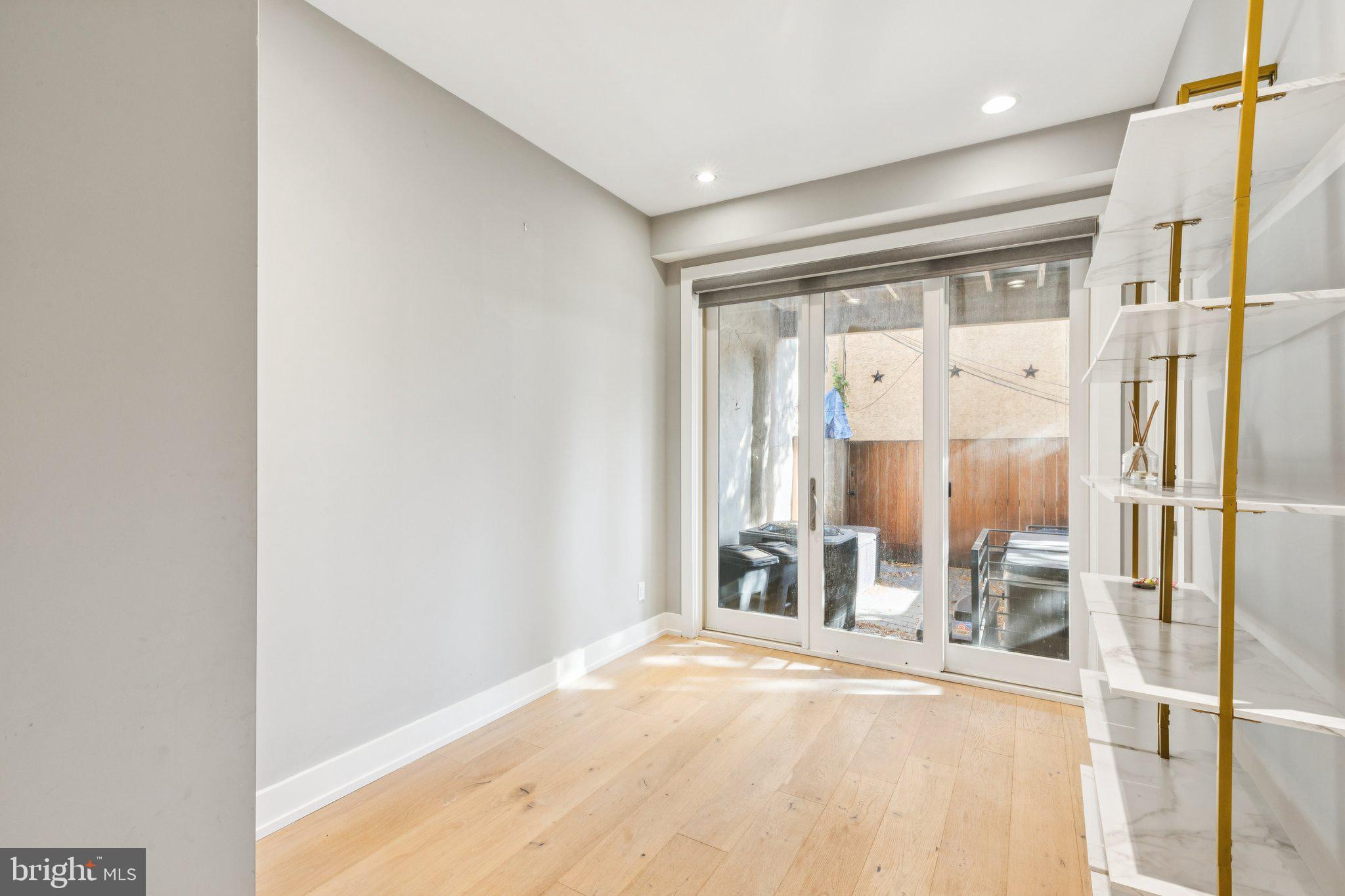 719 South 20th Street Philadelphia, PA 19146 - Photo 4 of 53 a view of a hallway with wooden shelves