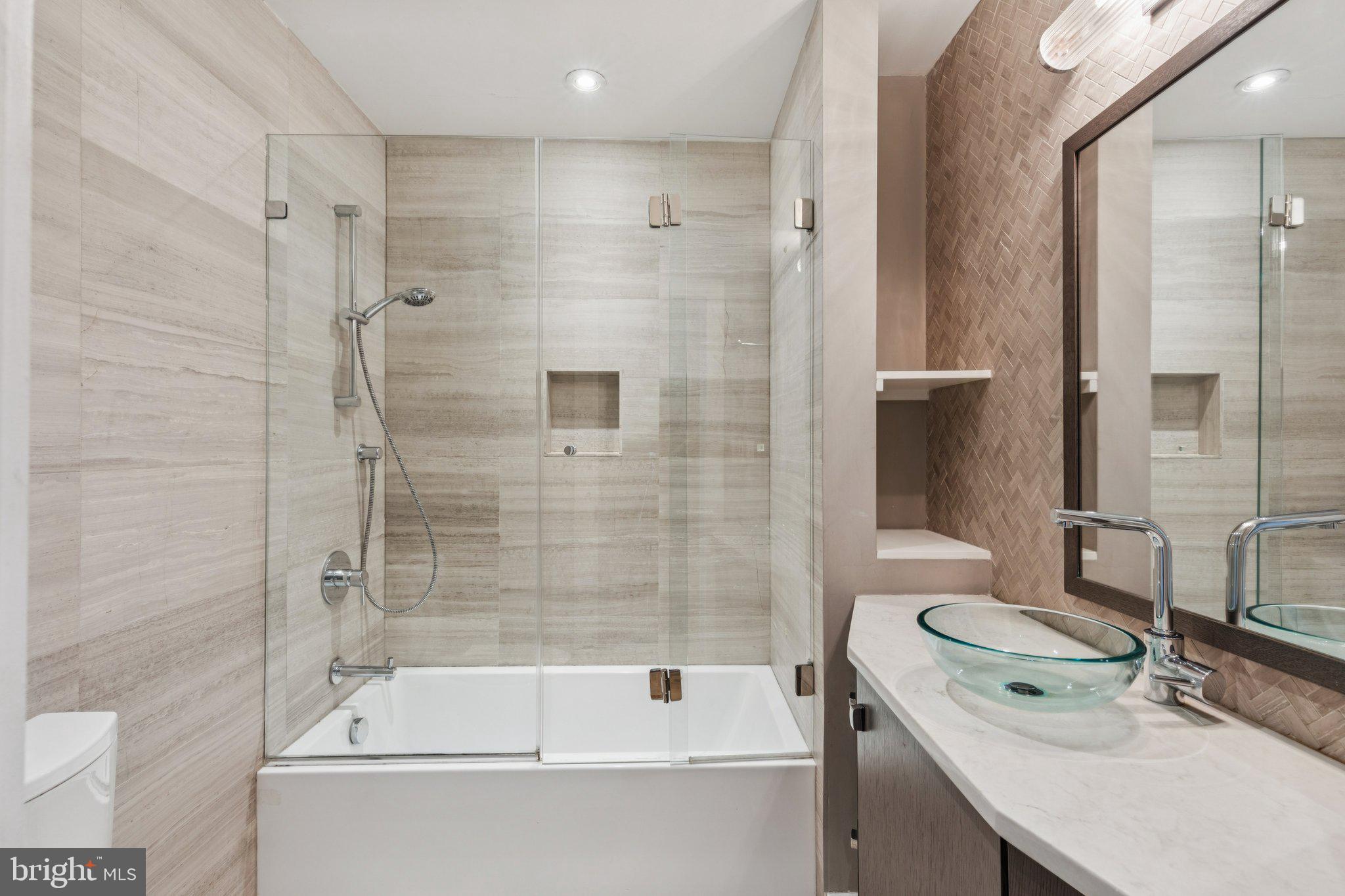 719 South 20th Street Philadelphia, PA 19146 - Photo 43 of 53 a bathroom with a tub shower sink vanity and toilet