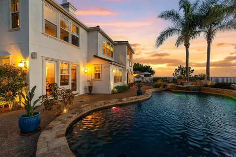 a view of a swimming pool with a lounge chairs