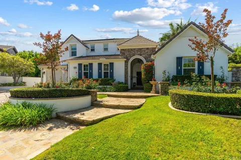 a front view of a house with swimming pool having outdoor seating