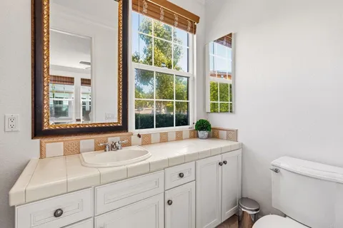 a bathroom with a sink and a window