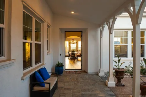 a view of an entryway with wooden floor and a porch
