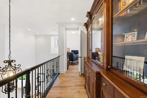 a living room with furniture and large windows