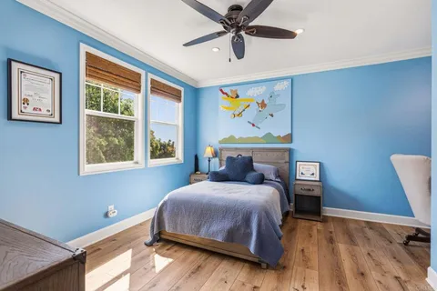 a room with gym equipment and windows