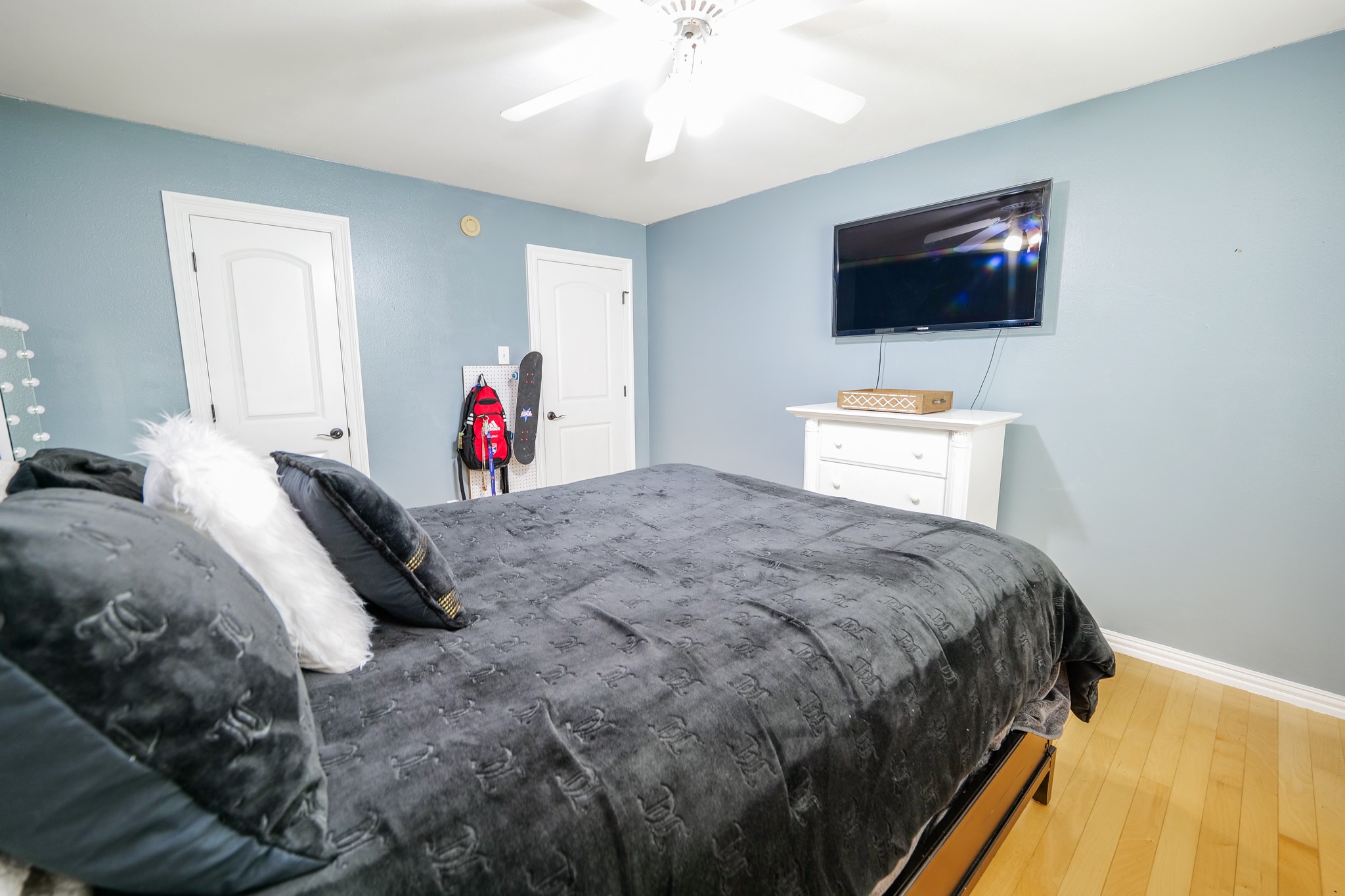 11606 Curry Ridge Lane Tomball, TX 77377 - Photo 18 of 28 The oversized secondary bedroom includes a built-in desk and shelves, providing the perfect setup for a home office, study space, or creative workstation.