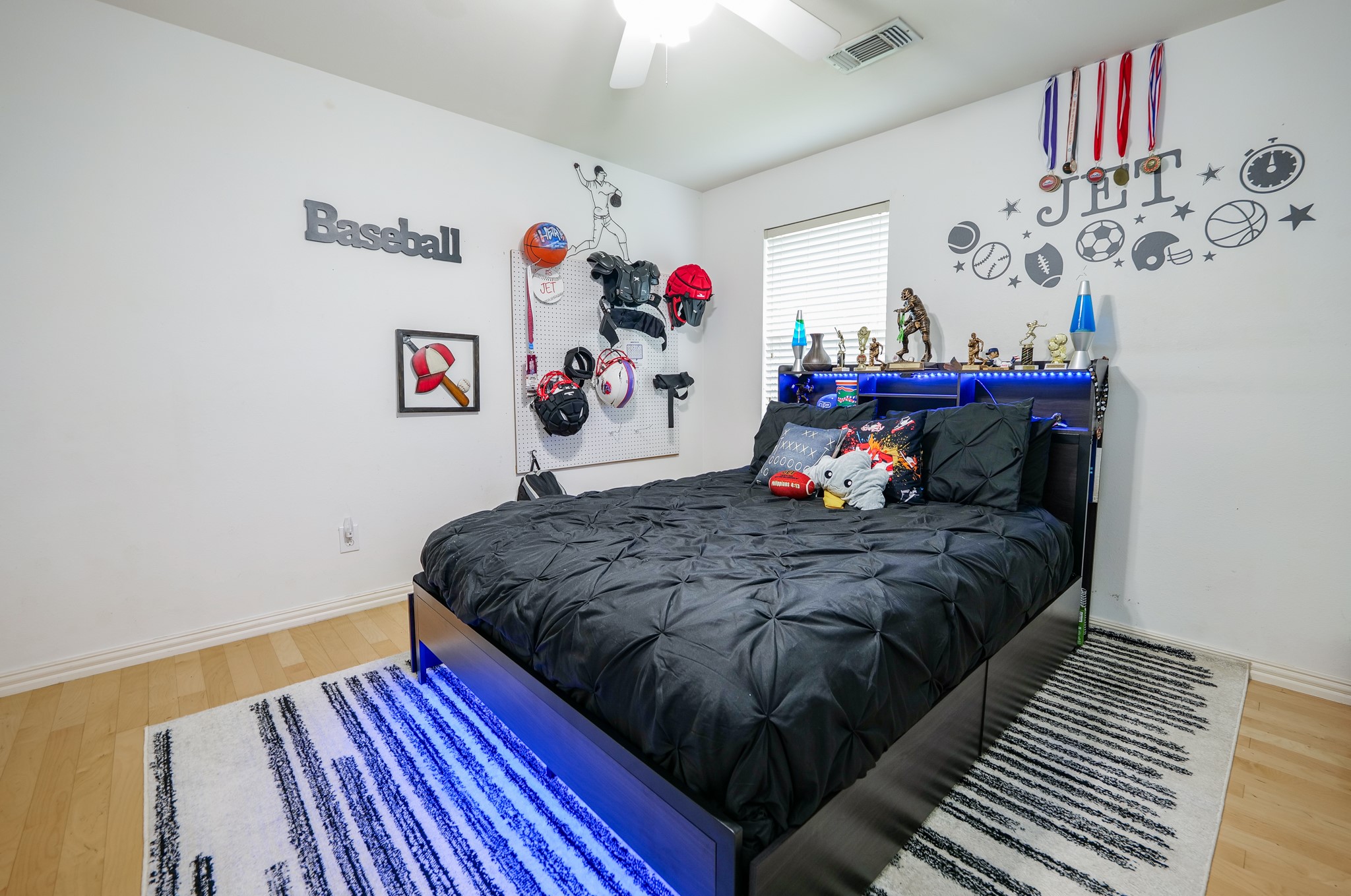 11606 Curry Ridge Lane Tomball, TX 77377 - Photo 20 of 28 The oversized secondary bedroom offers generous space, large windows for natural light, and flexibility for various furniture layouts or uses.