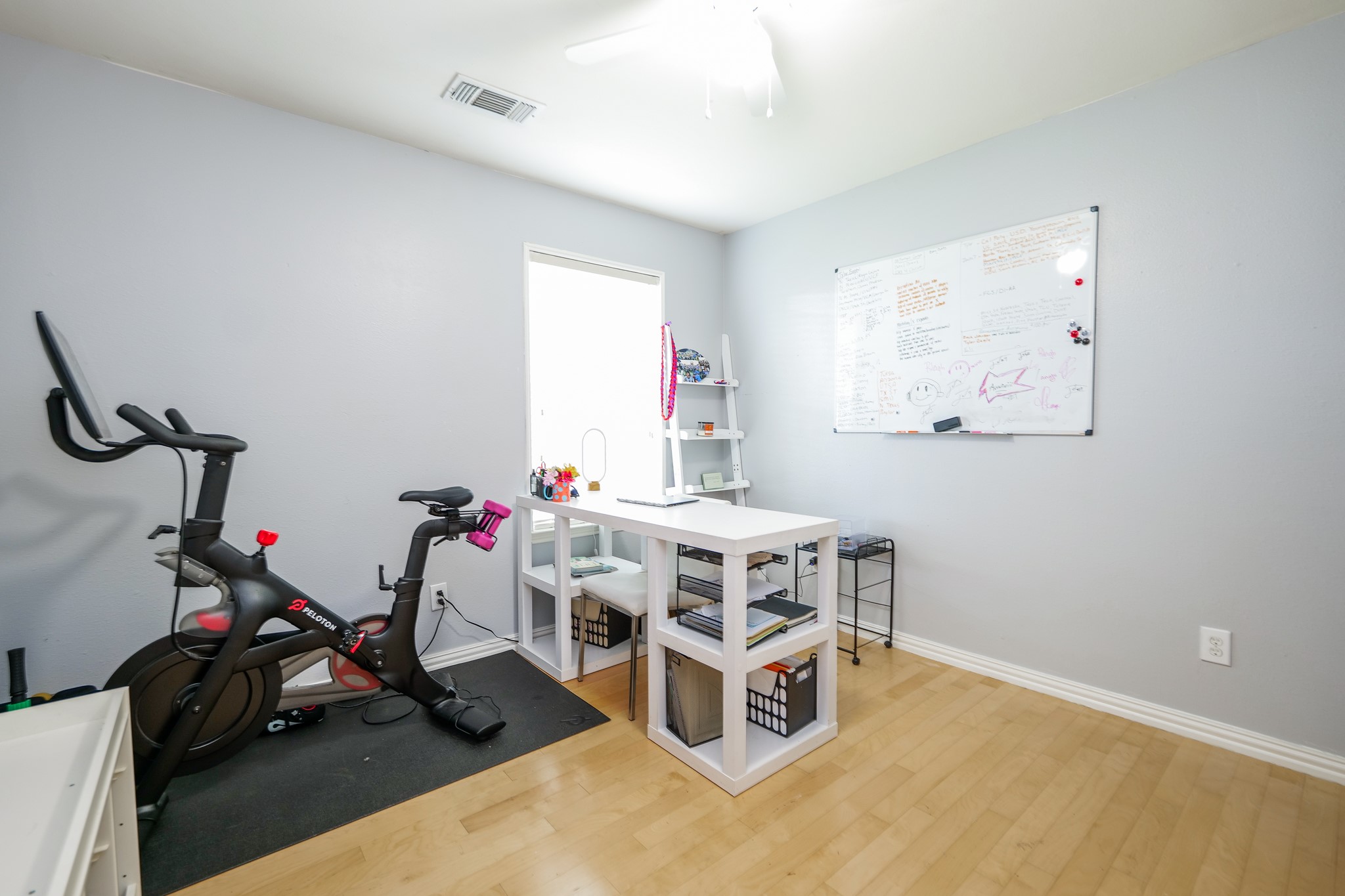 11606 Curry Ridge Lane Tomball, TX 77377 - Photo 21 of 28 The oversized secondary bedroom is currently utilized as a versatile home office and gym, offering ample space and flexibility to suit your lifestyle needs.