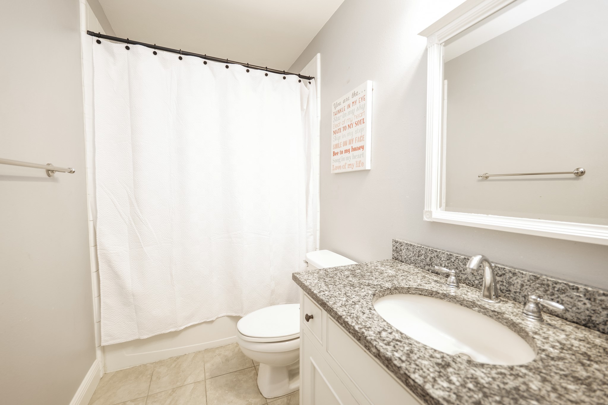 11606 Curry Ridge Lane Tomball, TX 77377 - Photo 25 of 28 The secondary bathroom features a clean, functional layout with a combination tub and shower, modern fixtures, and ample storage which includes built-in shelves.