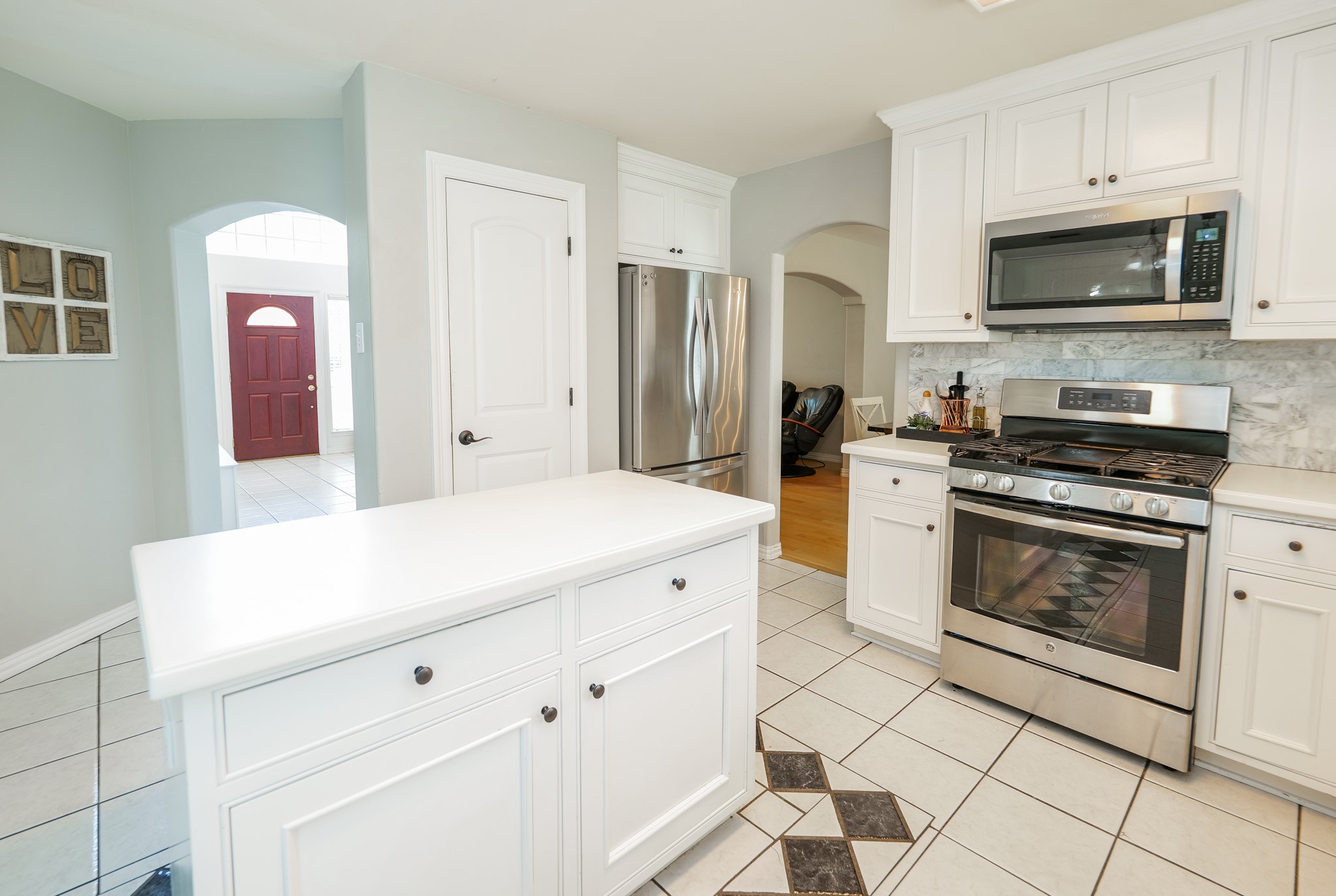 11606 Curry Ridge Lane Tomball, TX 77377 - Photo 7 of 28 The kitchen features modern appliances, ample cabinet space, and a convenient layout perfect for everyday cooking and entertaining.