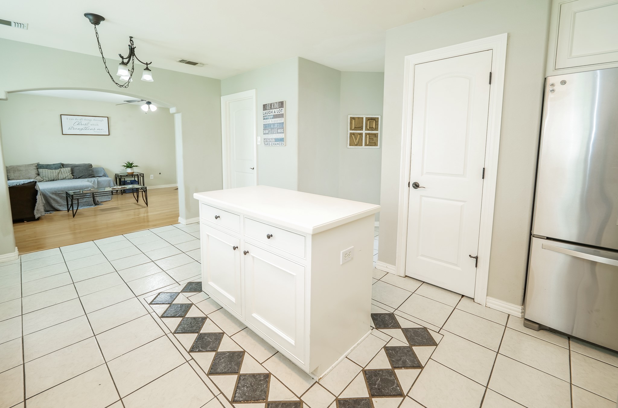 11606 Curry Ridge Lane Tomball, TX 77377 - Photo 8 of 28 The kitchen opens into a cozy secondary living room, creating a seamless flow for comfortable living and easy entertaining.