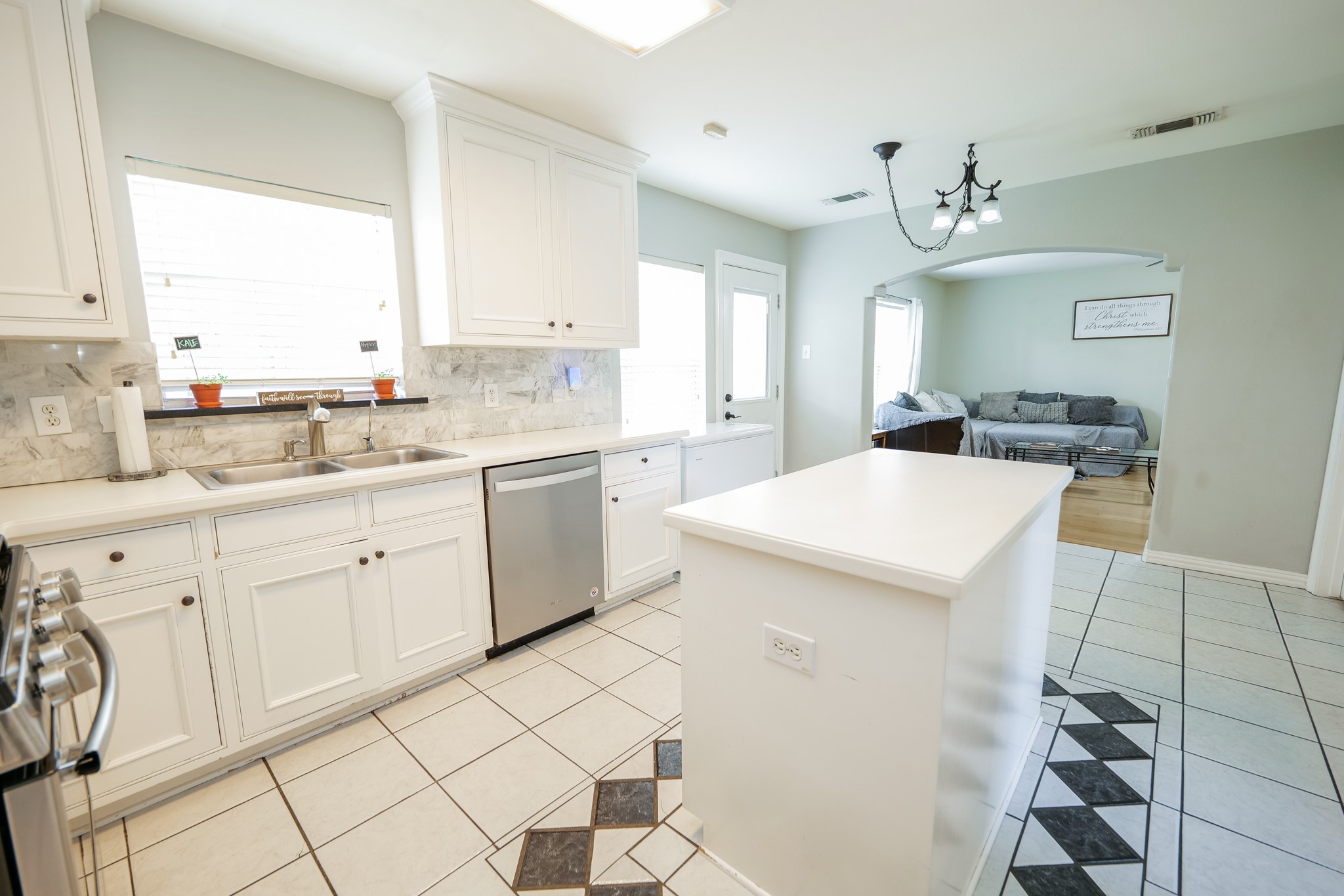 11606 Curry Ridge Lane Tomball, TX 77377 - Photo 10 of 28 The spacious kitchen island offers additional counter space, and storage, making it a perfect centerpiece for meal prep and casual gatherings.