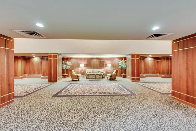 a living room with a couch and a large window