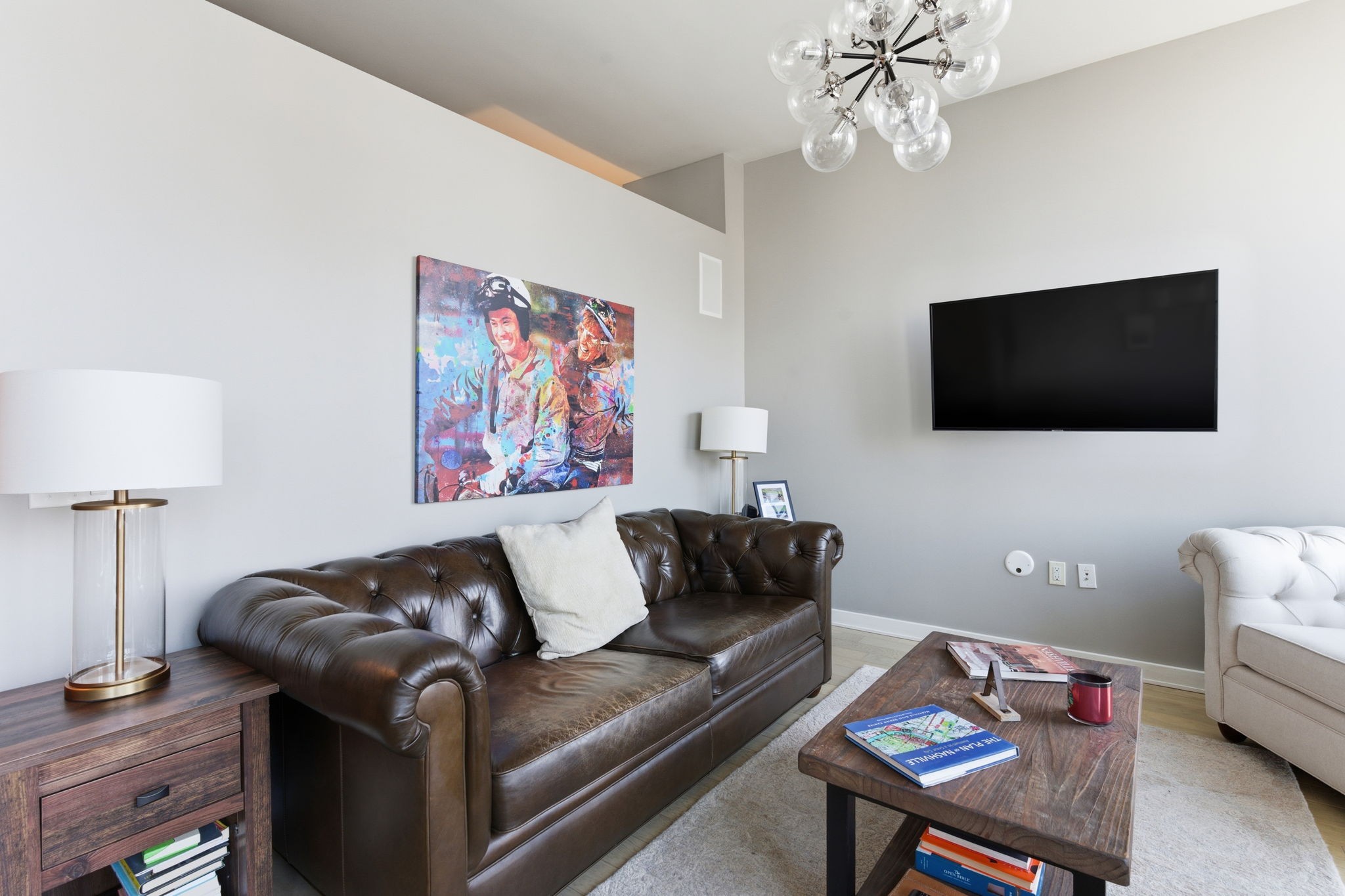 1212 Laurel Street, Unit 2010 Nashville, TN 37203 - Photo 4 of 11 a living room with furniture and a flat screen tv