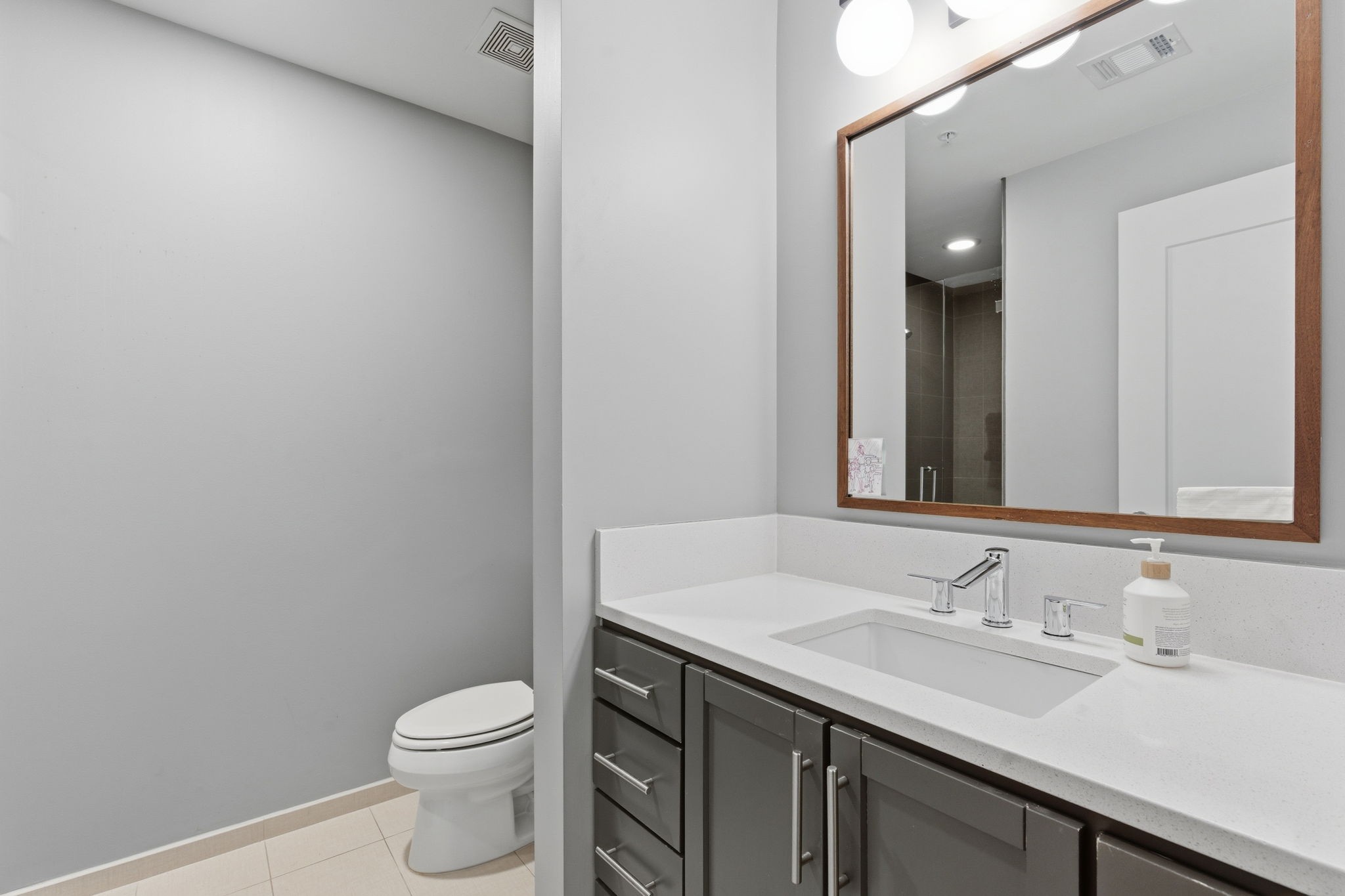 1212 Laurel Street, Unit 2010 Nashville, TN 37203 - Photo 8 of 11 a bathroom with a sink and a toilet
