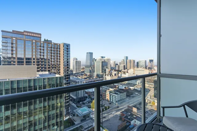 a view of a balcony with city view