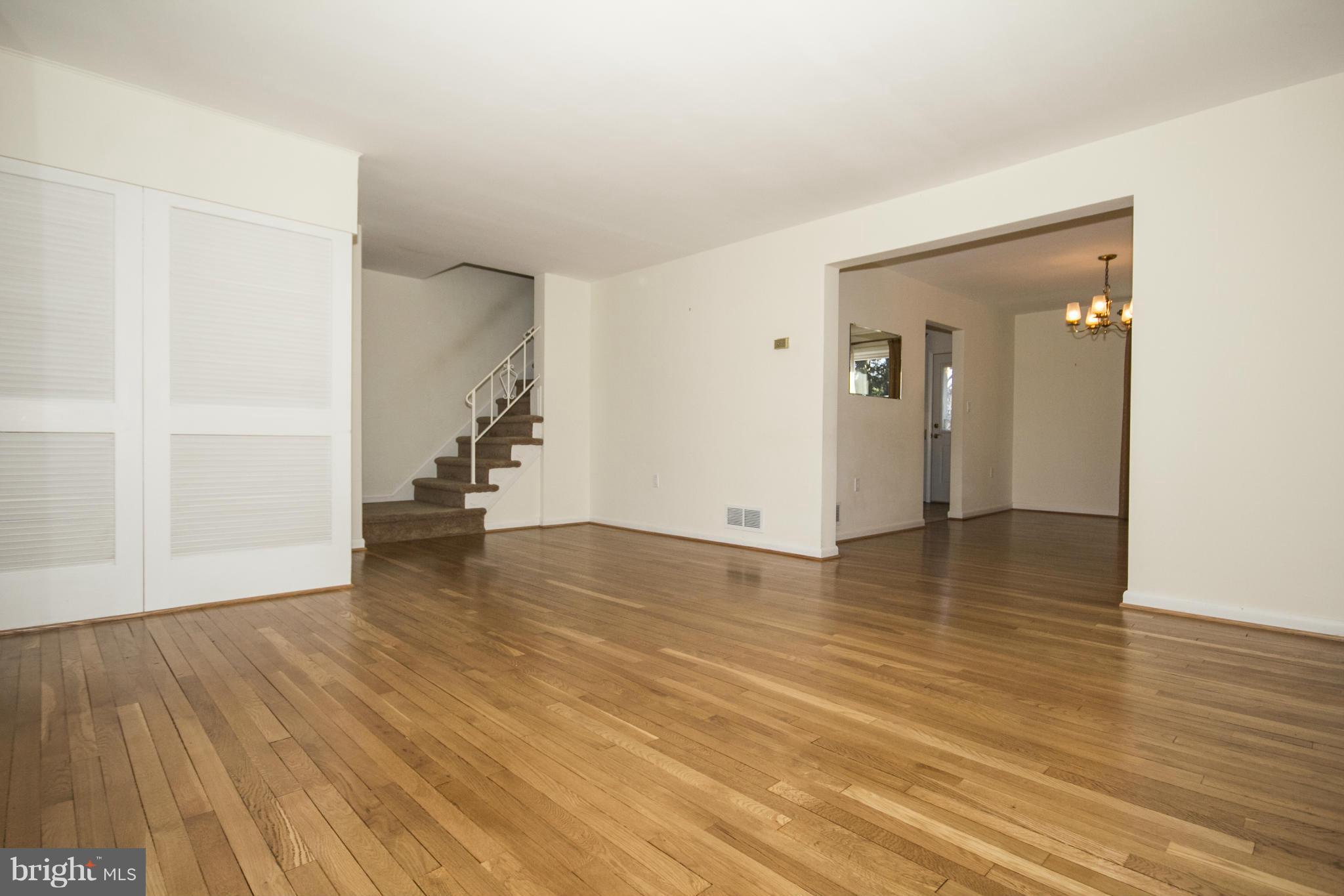 1305 Knightswood Road Baltimore, MD 21239 - Photo 5 of 29 wooden floor in an empty room