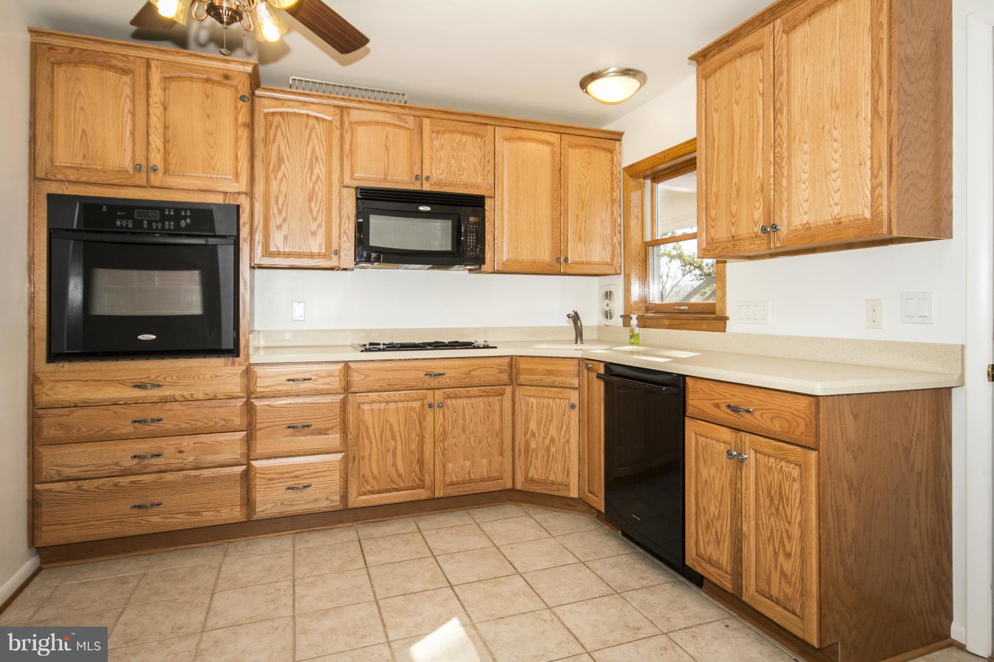1305 Knightswood Road Baltimore, MD 21239 - Photo 8 of 29 a kitchen with cabinets appliances and a sink