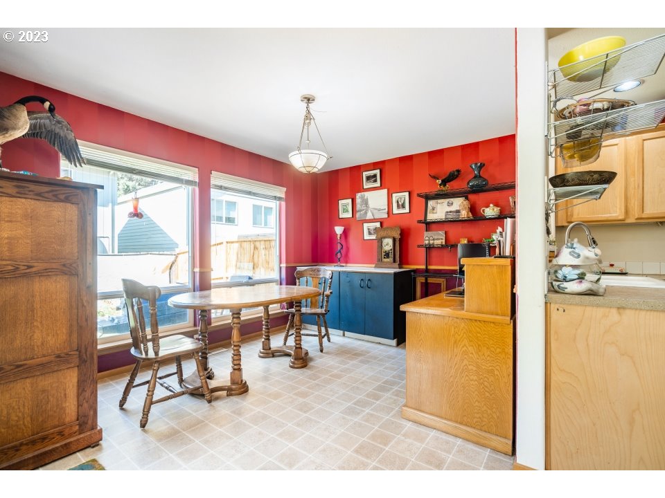 15469 Southwest Bygones Court Beaverton, OR 97007 - Photo 11 of 32 a living room with furniture and a chandelier