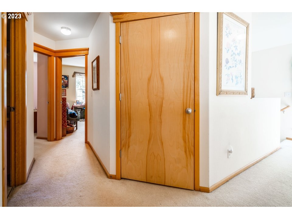 15469 Southwest Bygones Court Beaverton, OR 97007 - Photo 22 of 32 a view of a room with wooden floor and windows