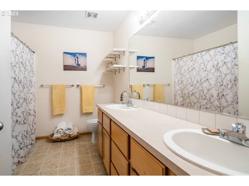 15469 Southwest Bygones Court Beaverton, OR 97007 - Photo 26 of 32 a bathroom with a sink and a mirror