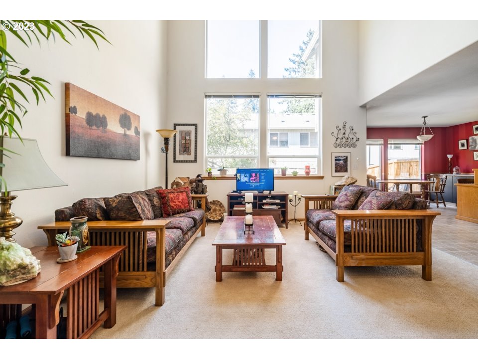 15469 Southwest Bygones Court Beaverton, OR 97007 - Photo 3 of 32 a living room with furniture and a large window