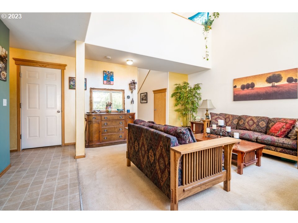 15469 Southwest Bygones Court Beaverton, OR 97007 - Photo 5 of 32 a living room with furniture and a flat screen tv