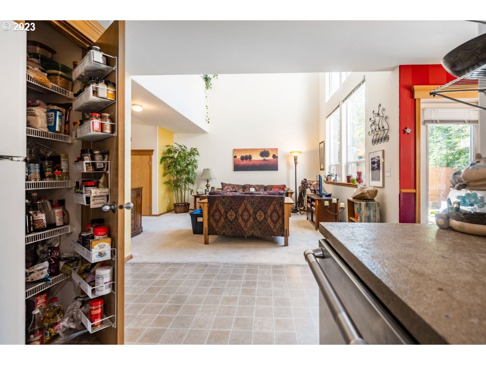 15469 Southwest Bygones Court Beaverton, OR 97007 - Photo 6 of 32 a view of a living room and workspace