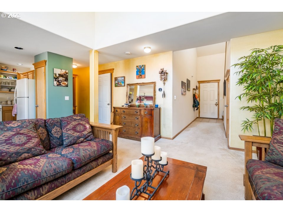 15469 Southwest Bygones Court Beaverton, OR 97007 - Photo 9 of 32 a living room with furniture and a large window